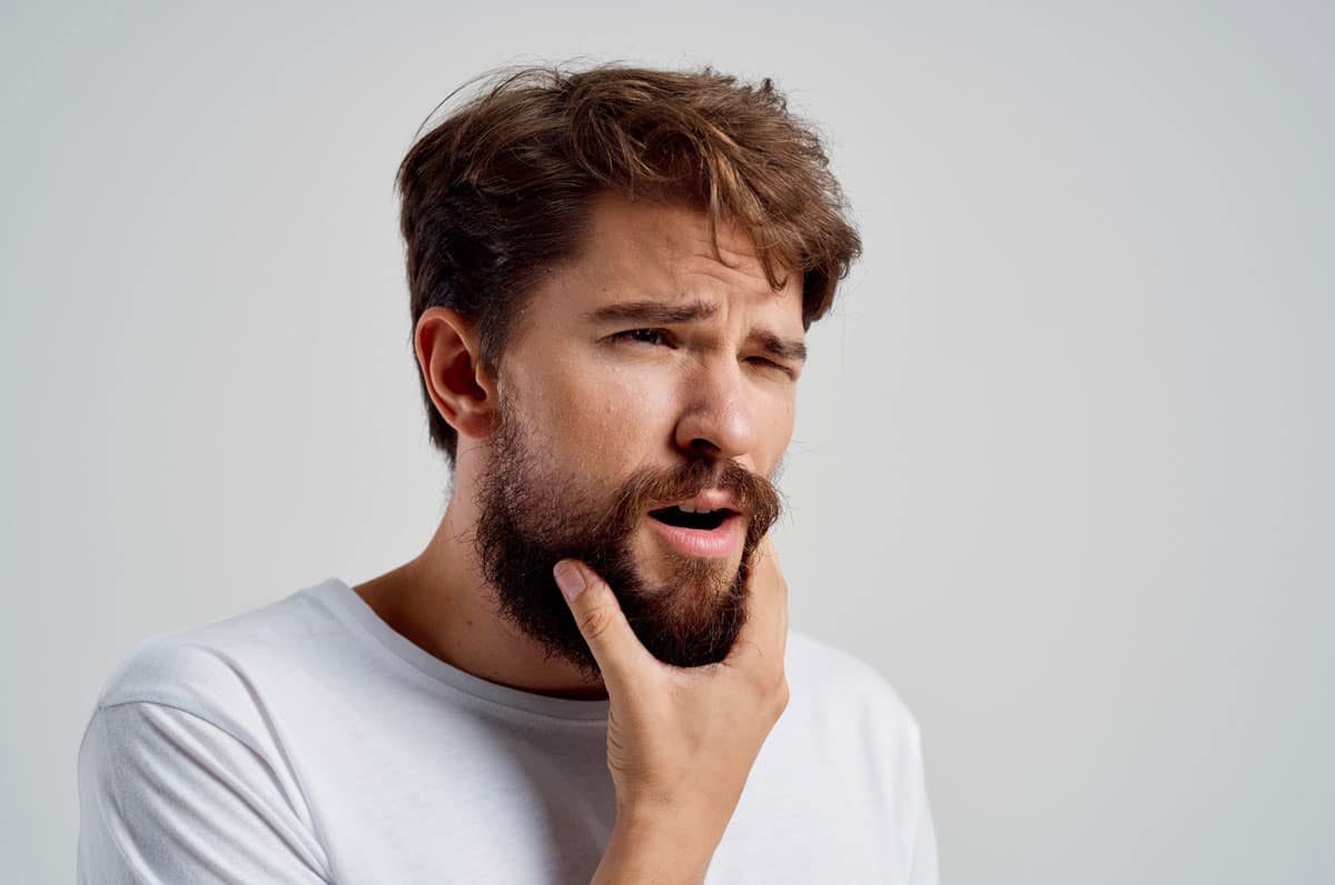 Click mandibolare quando apri la bocca: cause e conseguenze